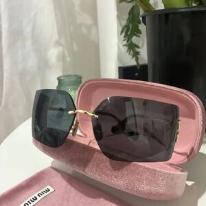 Miu Miu Black Sunglasses with Gold Detail